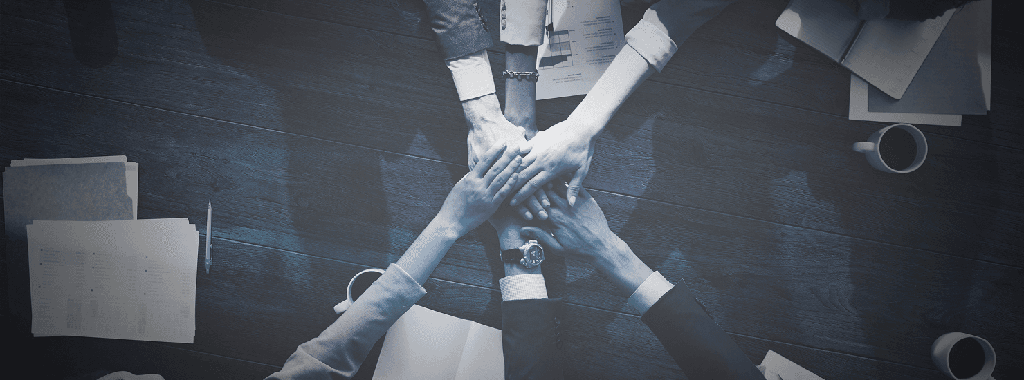 Team hands joining together